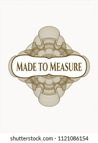 Brown abstract rosette with text Made to Measure inside