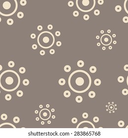 The brown abstract sun on an dark background seamless structure