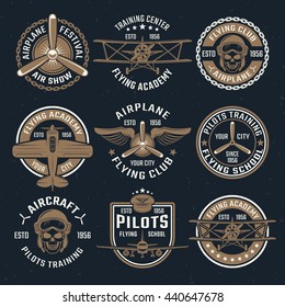 Brown airplane emblem set isolated on black background with different shapes on flying academy theme vector illustration