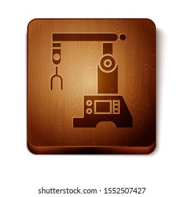 Brown Assembly line icon isolated on white background. Automatic production conveyor. Robotic industry concept. Wooden square button. Vector Illustration