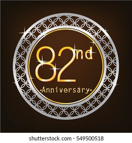 brown background and silver circle 82nd anniversary