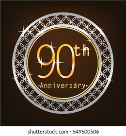 brown background and silver circle 90th anniversary