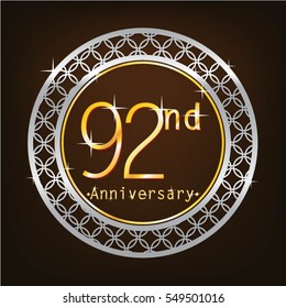 brown background and silver circle 92nd anniversary