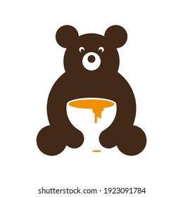 Brown bear with a cup of honey. Logo bear with a big cup of honey in his hands on a white background