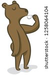 A brown bear sips a cup of espresso.