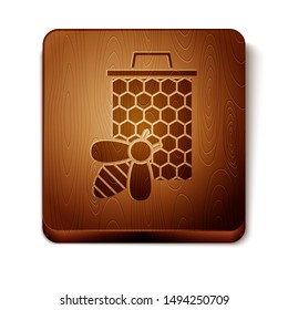 Brown Bee and honeycomb icon isolated on white background. Honey cells. Sweet natural food. Honeybee or apis with wings symbol. Flying insect. Wooden square button. Vector Illustration