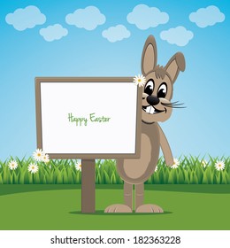 brown bunny behind sign on spring lawn landscape