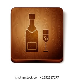 Brown Champagne bottle and glass of champagne icon isolated on white background. Merry Christmas and Happy New Year. Wooden square button. Vector Illustration
