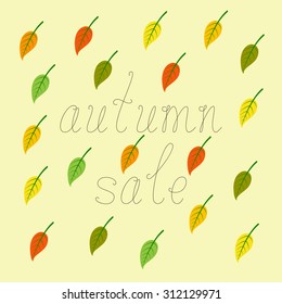 Brown colored calligraphic lettering autumn sale and colorful leaves with green veins isolated on flaxen background