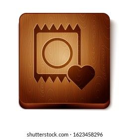 Brown Condom in package icon isolated on white background. Safe love symbol. Contraceptive method for male. Wooden square button. Vector Illustration