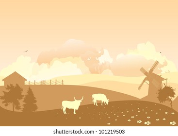 brown country landscape with cows on field