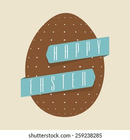 Brown dotted egg covered by blue ribbon for Happy Easter celebration.