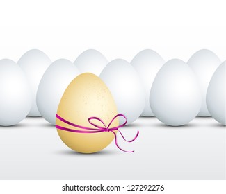 Brown egg with ribbon on background