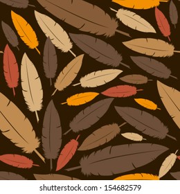 brown feathers on dark brown seamless pattern