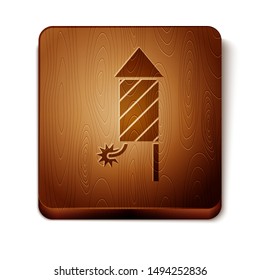 Brown Firework rocket icon isolated on white background. Concept of fun party. Explosive pyrotechnic symbol. Wooden square button. Vector Illustration