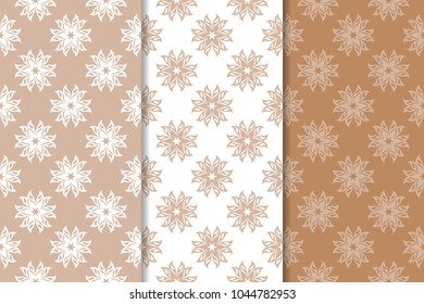 Brown floral backgrounds. Set of seamless patterns for textile and wallpapers