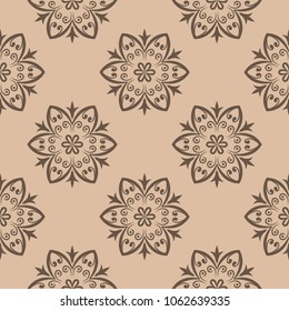 Brown floral design on beige background. Seamless pattern for textile and wallpapers