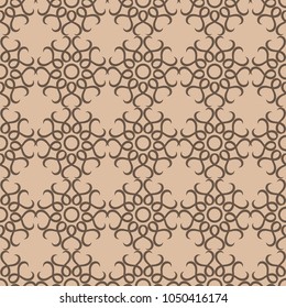 Brown floral ornament on beige background. Seamless pattern for textile and wallpapers