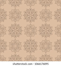 Brown floral ornament on beige background. Seamless pattern for textile and wallpapers