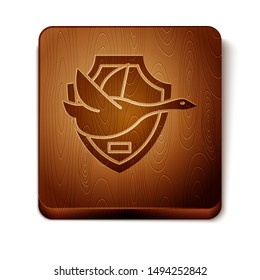 Brown Flying duck on shield icon isolated on white background. Hunting trophy on wall. Wooden square button. Vector Illustration