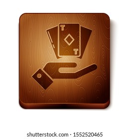 Brown Hand holding deck of playing cards icon isolated on white background. Casino gambling. Wooden square button. Vector Illustration
