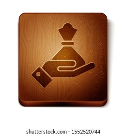 Brown Hand holding money bag icon isolated on white background. Dollar or USD symbol. Cash Banking currency sign. Wooden square button. Vector Illustration