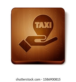 Brown Hand on map pointer with taxi icon isolated on white background. Location symbol. Wooden square button. Vector Illustration