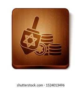 Brown Hanukkah dreidel and coin icon isolated on white background. Wooden square button. Vector Illustration