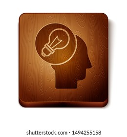 Brown Human head with lamp bulb icon isolated on white background. Wooden square button. Vector Illustration
