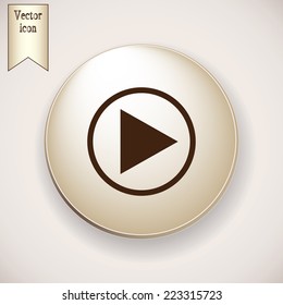 Brown icon on the round button with shadow. Vector icon start