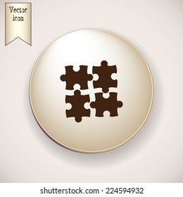 Brown icon on the round button with shadow. puzzle vector icon 