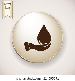 Brown icon on the round button with shadow. drop in hand - vector icon 