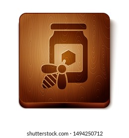 Brown Jar of honey with bee icon isolated on white background. Sweet natural food in bank. Honeybee or apis with wings symbol. Flying insect. Wooden square button. Vector Illustration