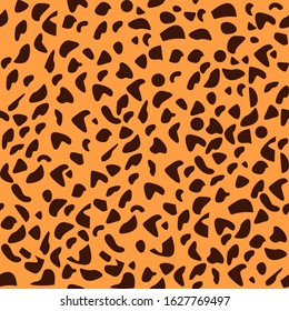 brown leopard spots on orange background. african style seamless vector pattern