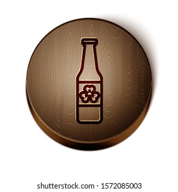 Brown line Beer bottle with four leaf clover icon isolated on white background. Happy Saint Patricks day. Wooden circle button. Vector Illustration