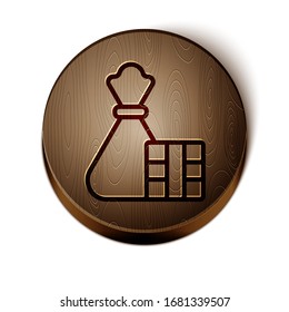 Línea marrón caja de regalo e icono de bolsa aislado en fondo blanco. Feliz Navidad y Feliz Año Nuevo. Botón de círculo de madera. Ilustración vectorial