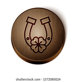 Brown line Horseshoe with four leaf clover icon isolated on white background. Happy Saint Patricks day. Wooden circle button. Vector Illustration