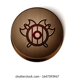 Línea marrón escudo medieval con icono de hachas cruzadas aislado en fondo blanco. Battle ax, verdugo hacha. Botón de círculo de madera.  Ilustración vectorial