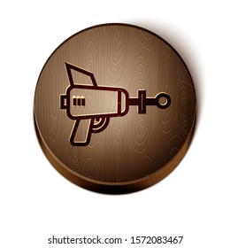 Brown line Ray gun icon isolated on white background. Laser weapon. Space blaster. Wooden circle button. Vector Illustration
