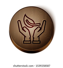 Brown line Sprout in hand of environmental protection icon isolated on white background. Seed and seedling. Planting sapling. Ecology concept. Wooden circle button. Vector Illustration