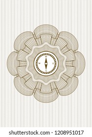 Brown linear rosette with compass icon inside