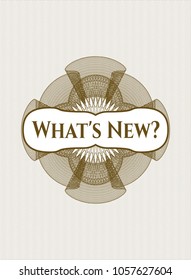 Brown linear rosette with text What's New? inside