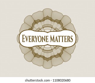 Brown money style emblem or rosette with text Everyone Matters inside