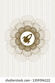 Brown money style emblem or rosette with rocket icon inside