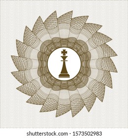 Brown money style emblem or rosette with chess king icon inside