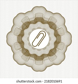 Braunes Geldstil - Emblem oder Rosette. mit einem Papierklammer-Symbol drinnen