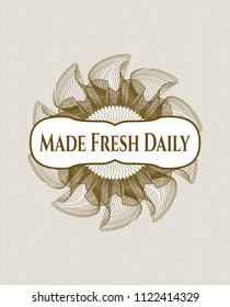 Brown money style rosette with text Made Fresh Daily inside