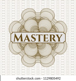 Brown money style rosette with text Mastery inside