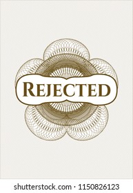 Brown money style rosette with text Rejected inside