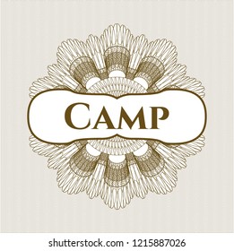 Brown money style rosette with text Camp inside